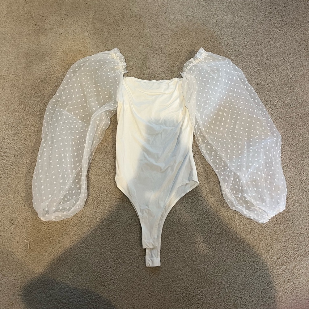 White bodysuit with capped puffed polka dot sleeves
